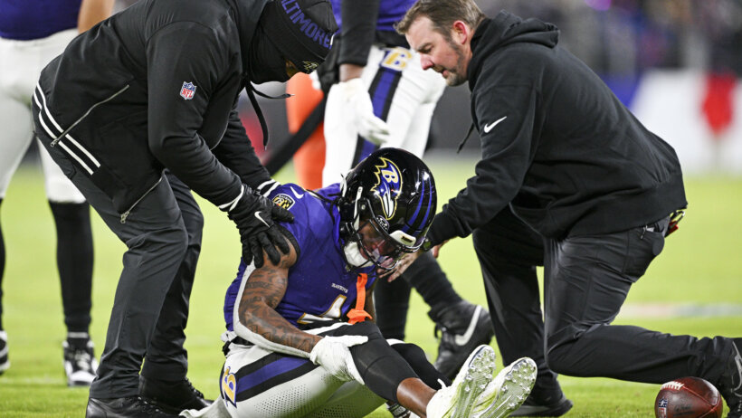 Baltimore Ravens wide receiver Zay Flowers on the ground injured
