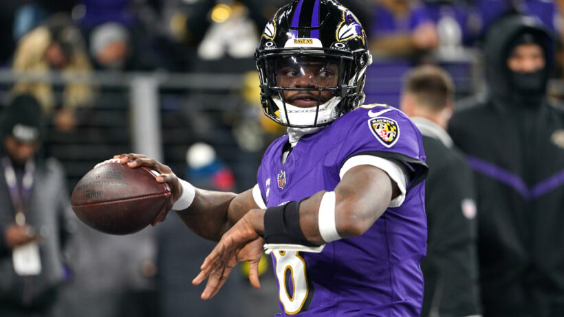 Baltimore Ravens quarterback Lamar Jackson warms up