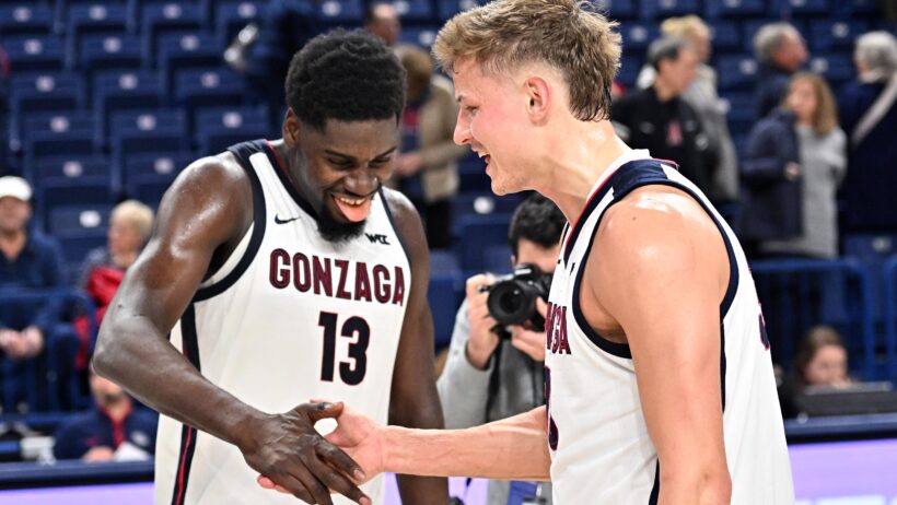 Gonzaga Bulldogs forwards Graham Ike and Ben Gregg celebrate a win