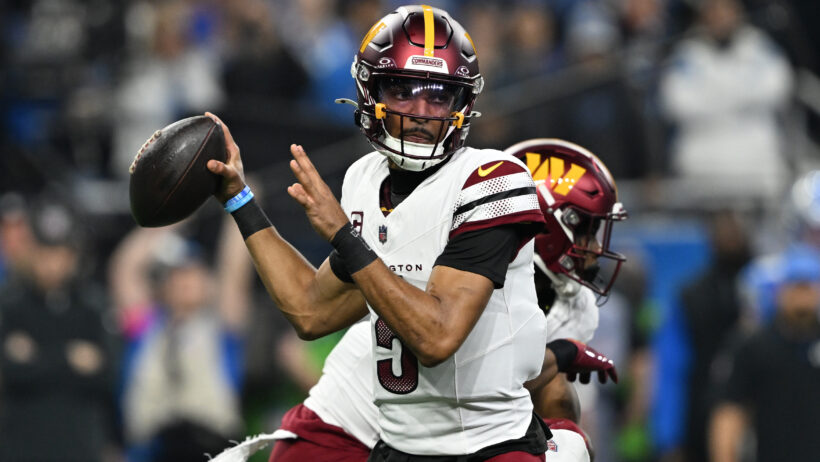 Washington Commanders quarterback Jayden Daniels throws a pass