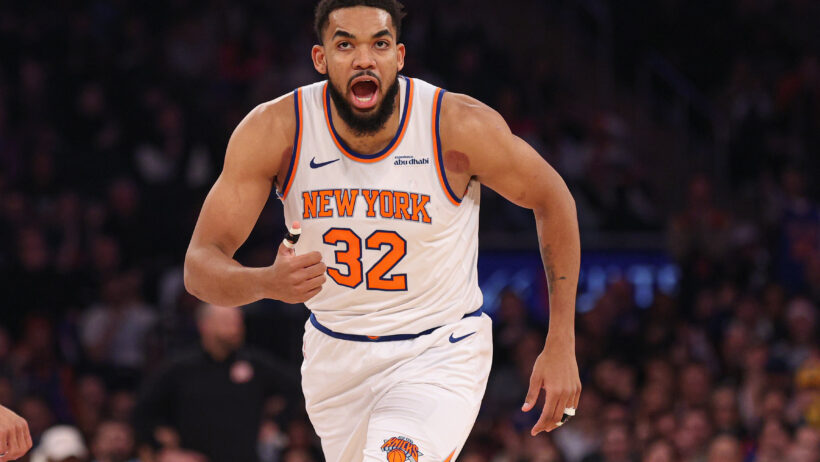 Karl-Anthony Towns reacts after drilling a three versus the Grizzlies.