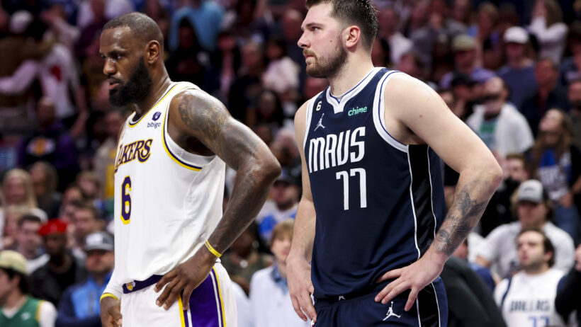 LeBron James standing beside Luka Doncic
