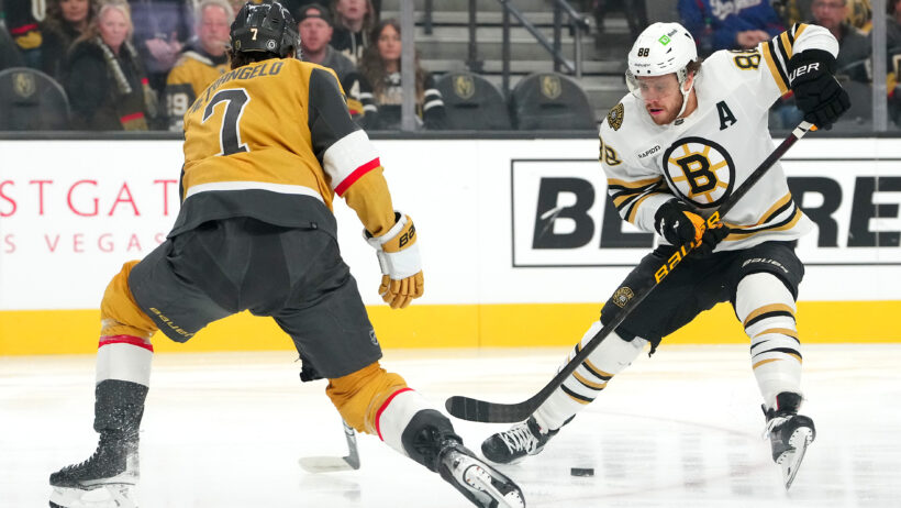 Boston Bruins right wing David Pastrnak skates around Vegas Golden Knights defenseman Alex Pietrangelo