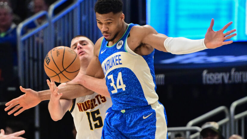 Nikola Jokic and Giannis Antetokounmpo battle for loose ball