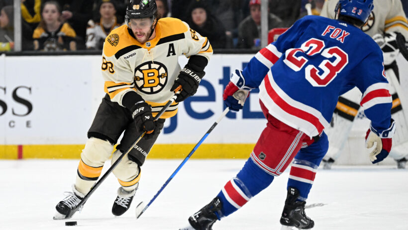 Boston Bruins right wing David Pastrnak skates with the puck