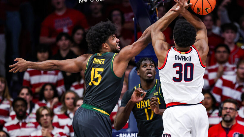 Baylor Bears forward Norchad Omier blocking a shot by Arizona Wildcats forward Tobe Awaka