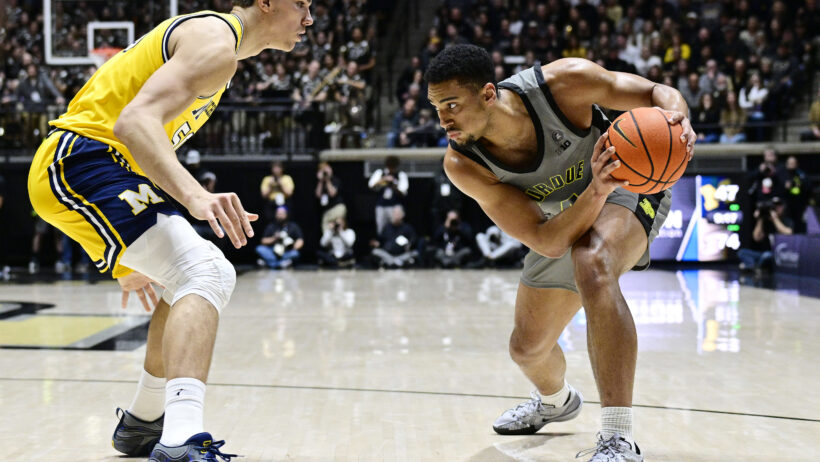 Purdue Boilermakers forward Trey Kaufman-Renn holds the ball as Michigan Wolverines center Vladislav Goldin defends