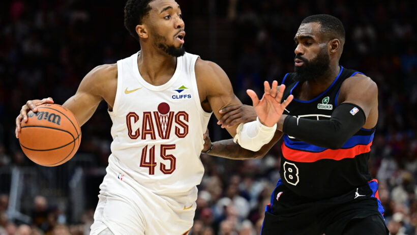 Cleveland Cavaliers guard Donovan Mitchell drives around Detroit Pistons forward Tim Hardaway Jr