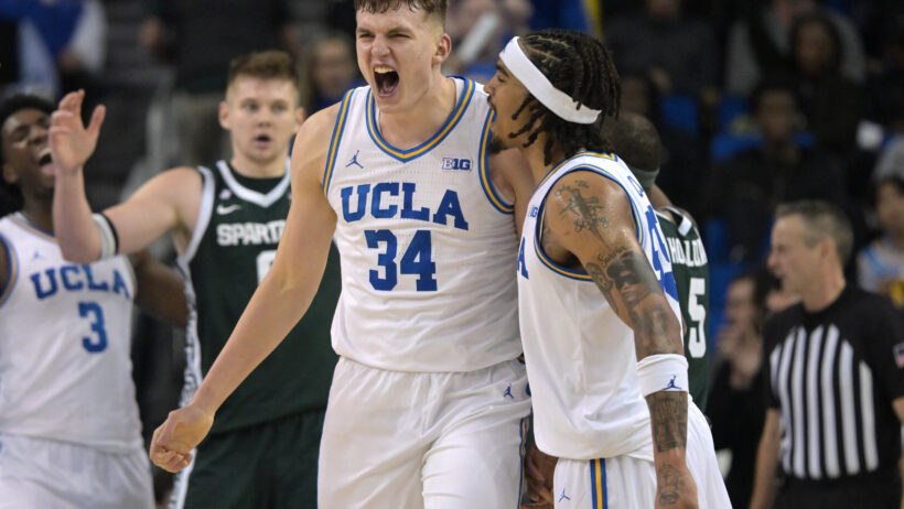 UCLA Bruins guard Skyy Clark and forward Tyler Bilodeau celebrate a basket
