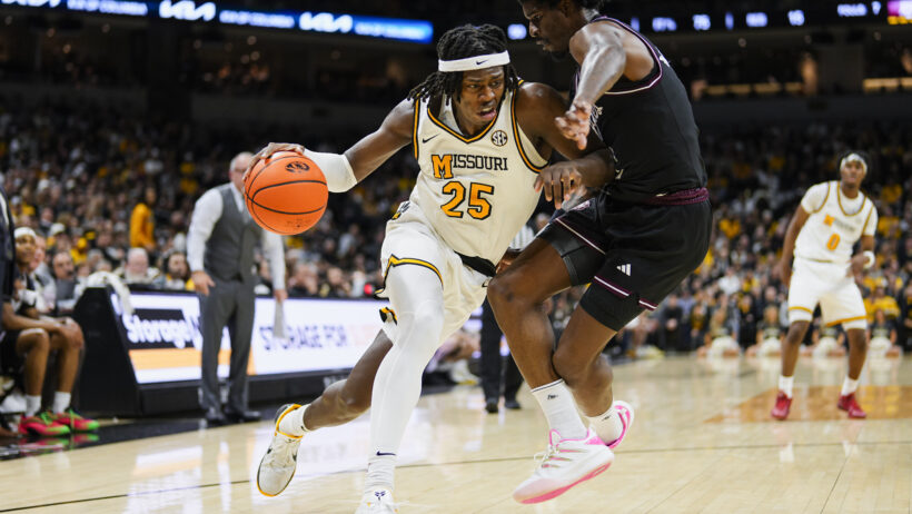 Missouri Tigers guard Mark Mitchell drives to hoop