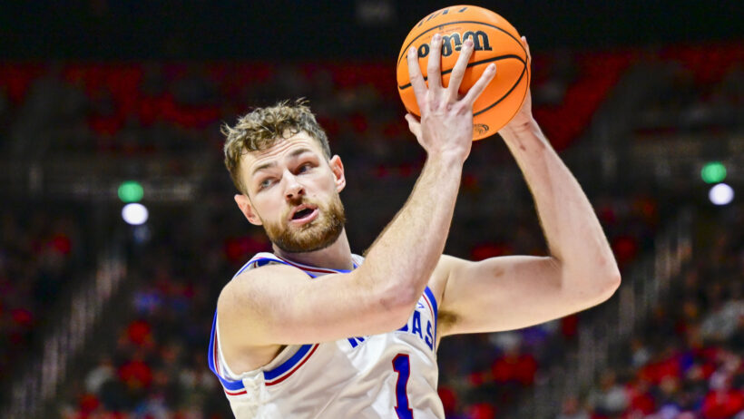 Kansas Jayhawks center Hunter Dickinson holding the ball