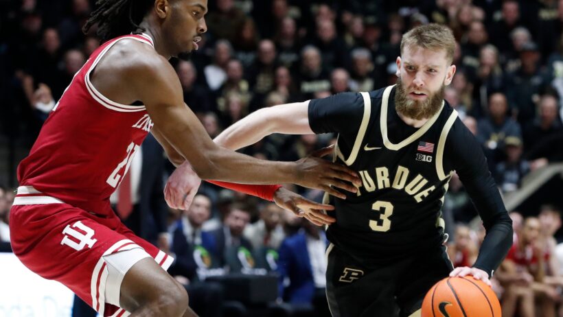 Purdue Boilermakers guard Braden Smith tries to dribble past Indiana Hoosiers forward Mackenzie Mgbako