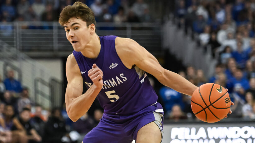 St. Thomas Tommies forward Parker Bjorklund dribbling