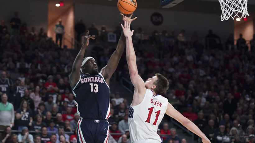 Gonzaga Bulldogs forward Graham Ike shooting over Saint Mary's Gaels center Mitchell Saxen
