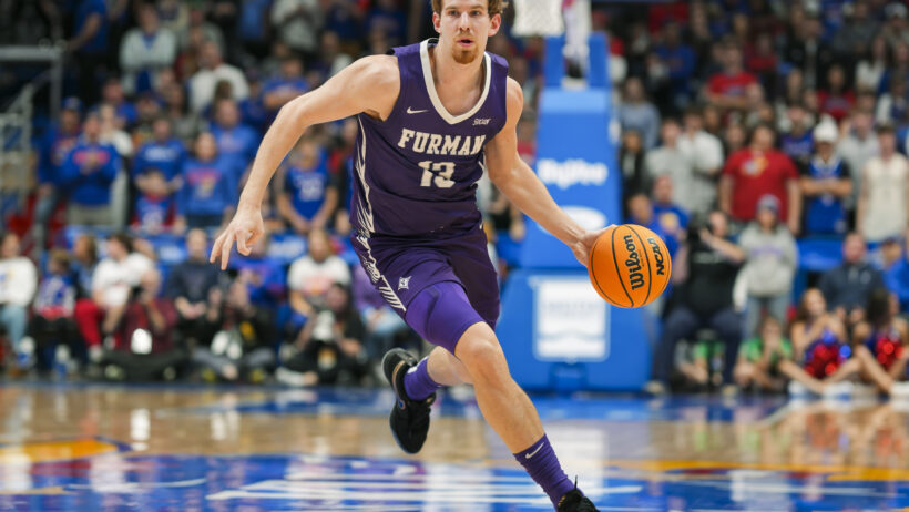 Furman Paladins guard Garrett Hien dribbling