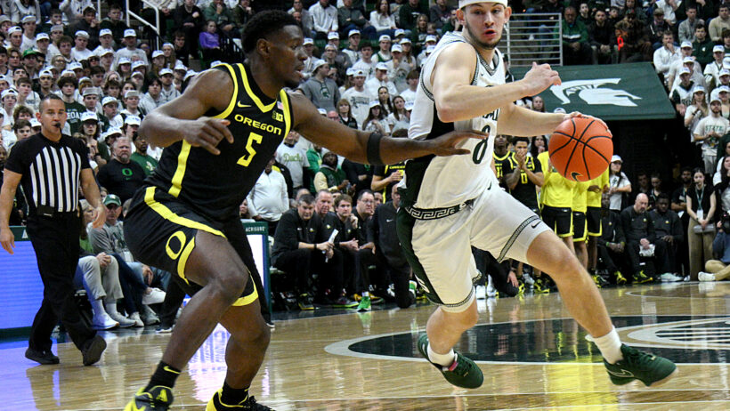 Michigan State Spartans forward Frankie Fidler drives around Oregon Ducks guard TJ Bamba