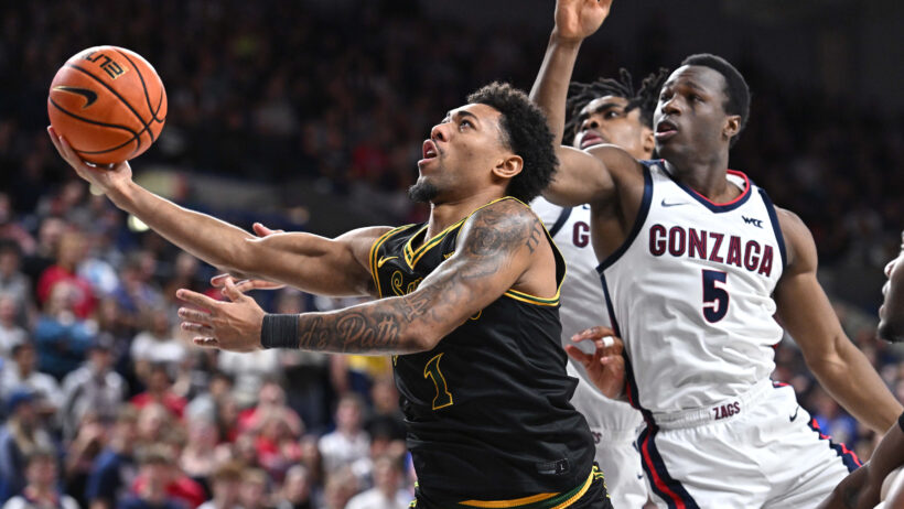 San Francisco Dons guard Malik Thomas rises for a layup against the Gonzaga Bulldogs