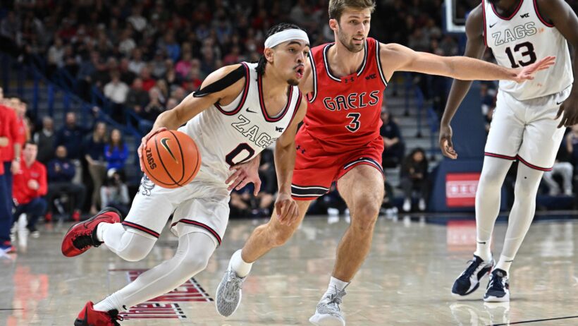 Gonzaga Bulldogs guard Ryan Nembhard dribbles around Saint Mary's Gaels guard Augustas Marciulionis