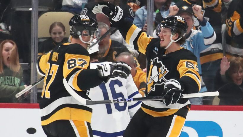 Pittsburgh Penguins center Sidney Crosby congratulates Pittsburgh Penguins right wing Rickard Rakell on goal