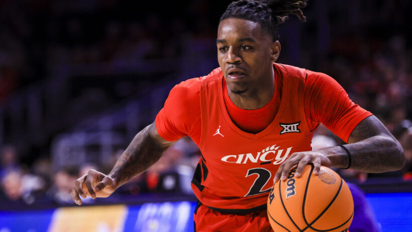 Cincinnati Bearcats guard Jizzle James dribbling to the basket