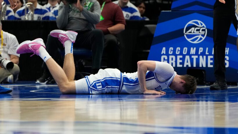 Duke Blue Devils forward Cooper Flagg lying on the court injured