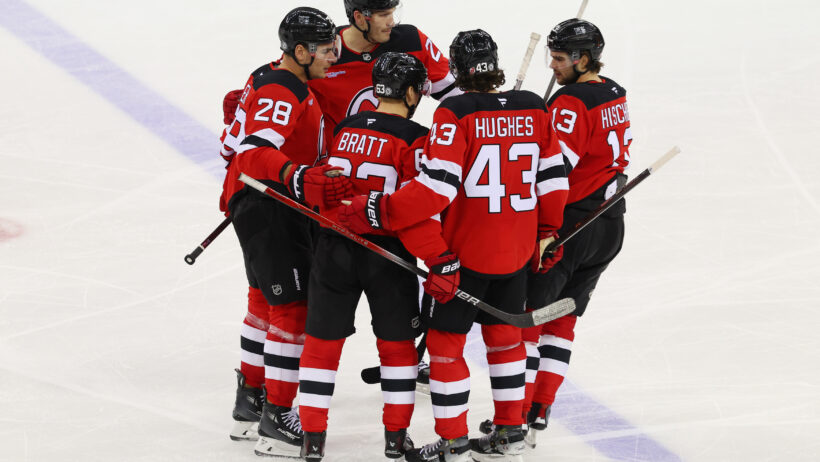 New Jersey Devils team celebrating goal on ice