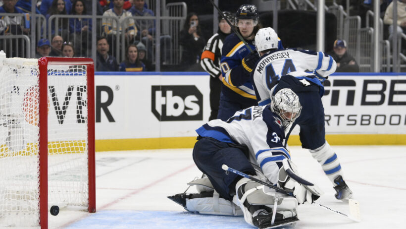 Connor Hellebuyck lets in a goal vs the Blues in Game 4 of their first round playoff series.