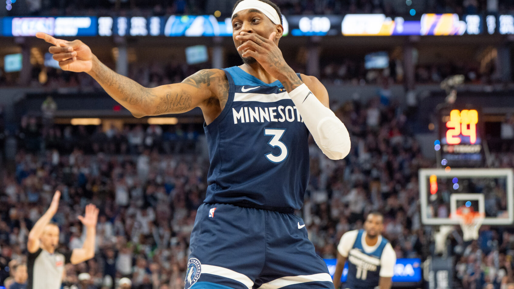 Minnesota Timberwolves forward Jaden McDaniels gestures after hitting a three