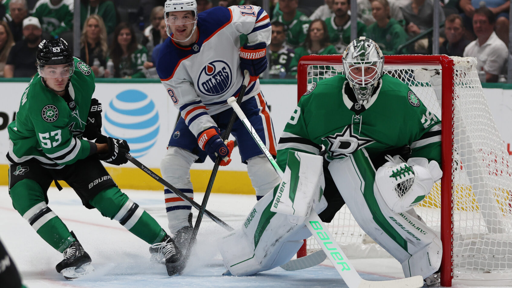 Edmonton Oilers left wing Zach Hyman (18) fights for position against Dallas Stars center Wyatt Johnston (53) and goaltender Jake Oettinger