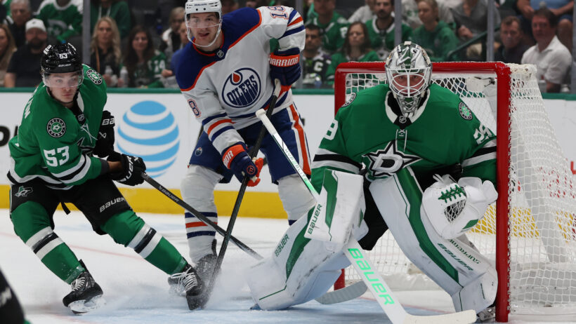 Edmonton Oilers left wing Zach Hyman (18) fights for position against Dallas Stars center Wyatt Johnston (53) and goaltender Jake Oettinger