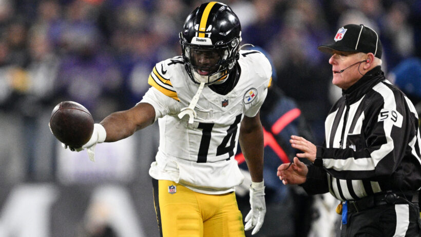 George Pickens gestures with the football during a Steelers playoff game.