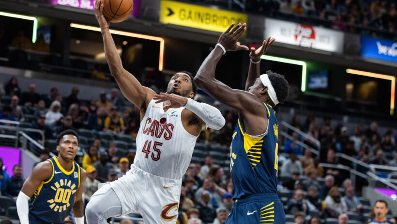 Cleveland Cavaliers guard Donovan Mitchell shoots a lay-up against Indiana Pacers forward Pascal Siakam