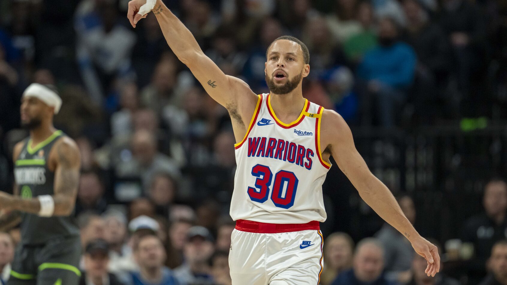 Golden State Warriors guard Stephen Curry gestures after hitting a three