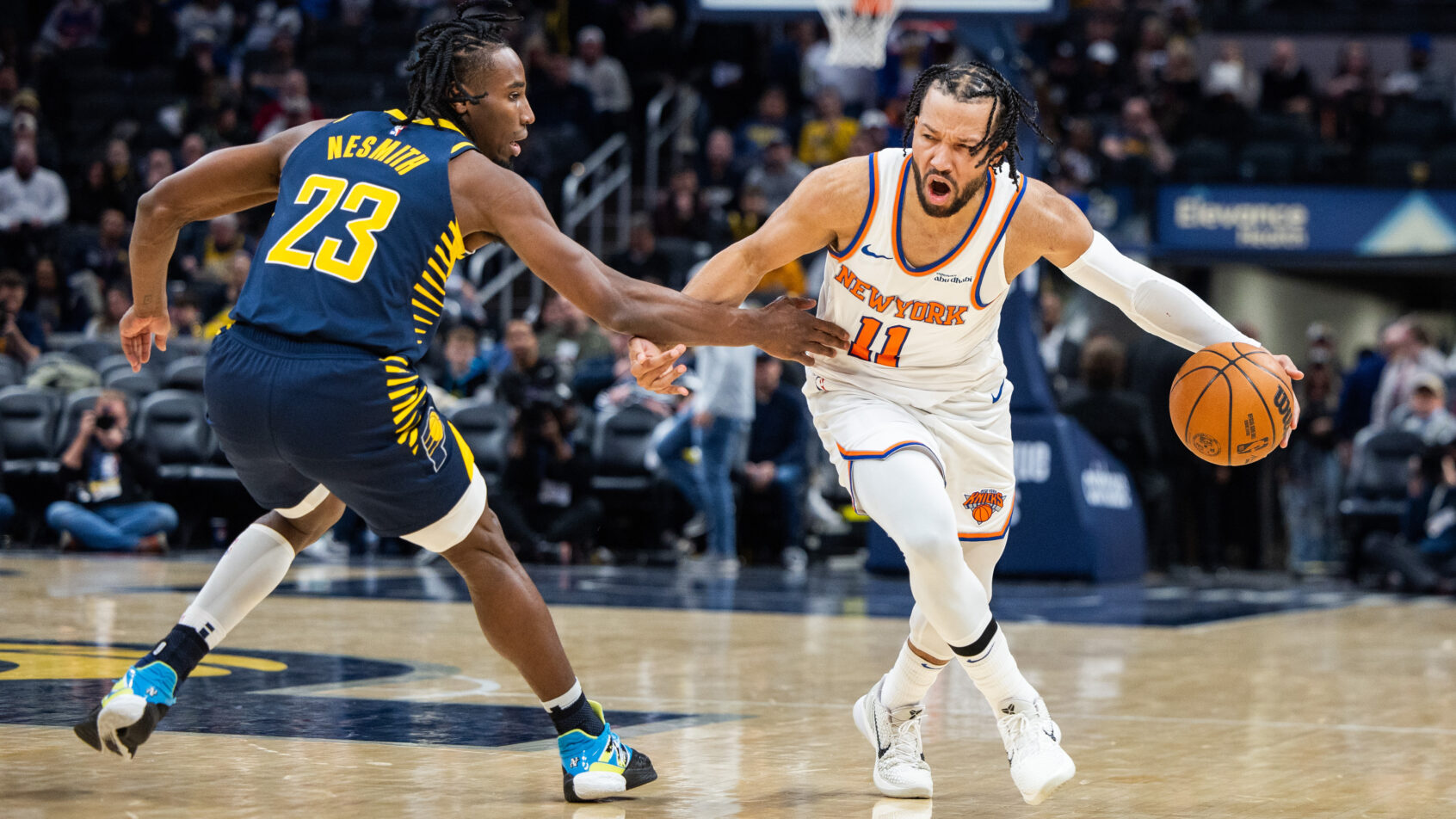 New York Knicks guard Jalen Brunson dribbling as Indiana Pacers forward Aaron Nesmith defends