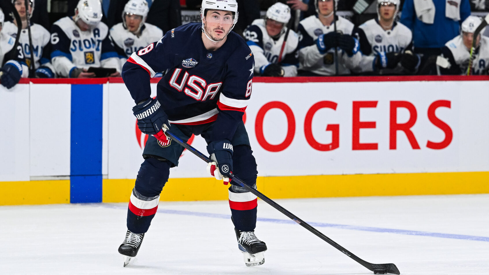 Team USA defenseman Zach Werenski plays the puck
