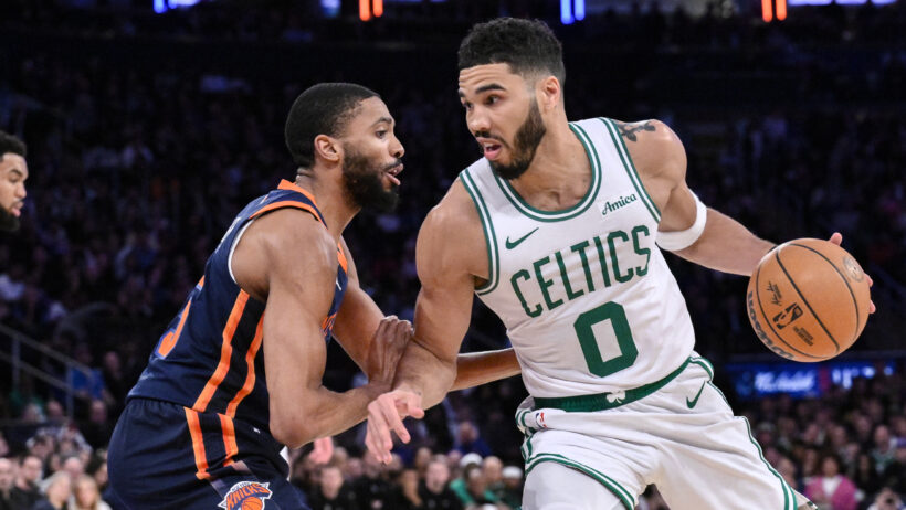 Boston Celtics forward Jayson Tatum backs down New York Knicks forward Mikal Bridges