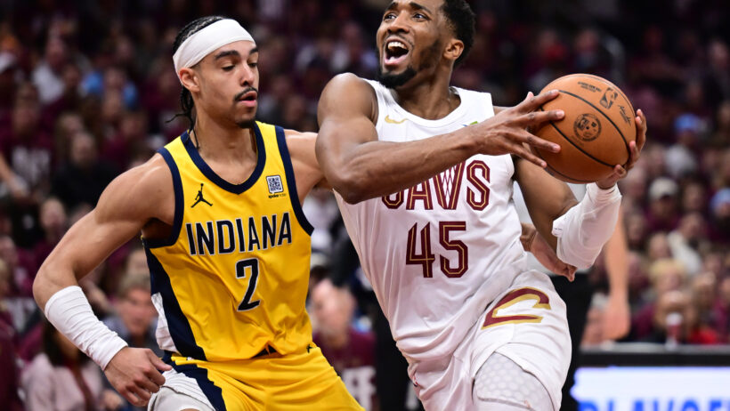 Cleveland Cavaliers guard Donovan Mitchell tries to drive past Indiana Pacers guard Andrew Nembhard