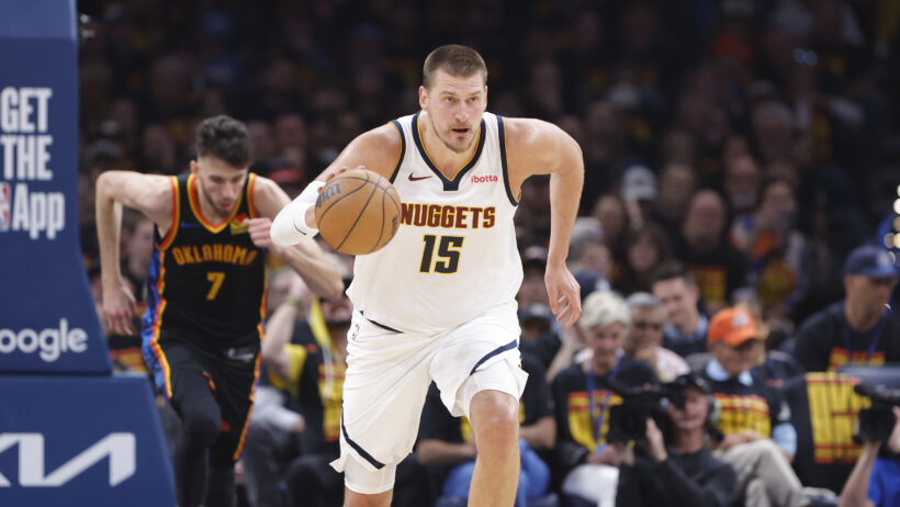 Denver Nuggets center Nikola Jokic dribbles up the court against the OKC Thunder