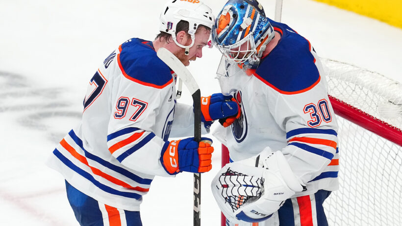 Connor McDavid celebrates with Calvin Pickard