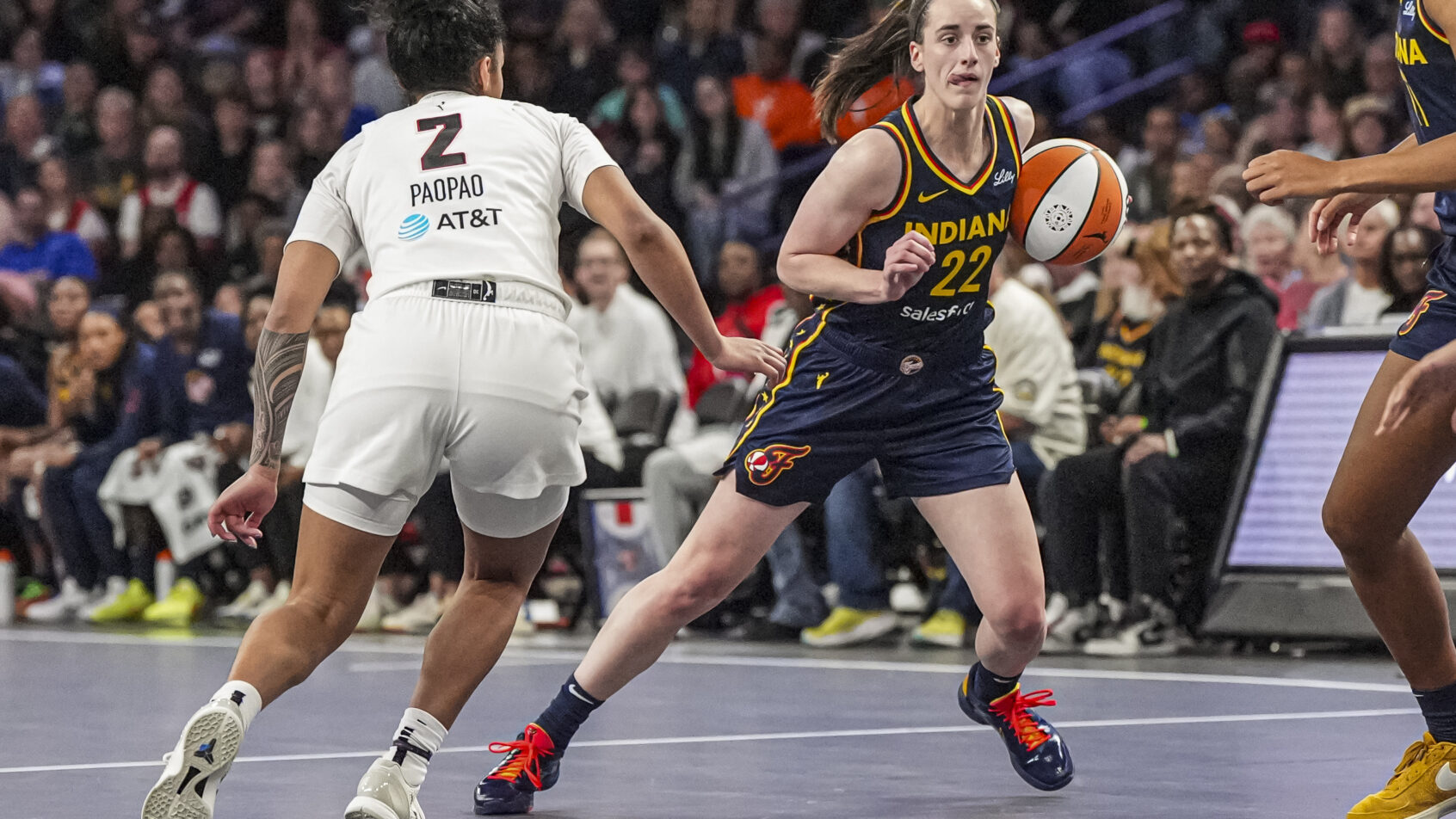 Indiana Fever guard Caitlin Clark controls the ball against the Atlanta Dream