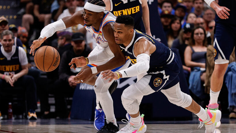 Oklahoma City Thunder guard Shai Gilgeous-Alexander and Denver Nuggets guard Russell Westbrook dive for a loose ball