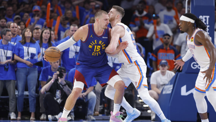 Denver Nuggets center Nikola Jokic backs down Oklahoma City Thunder center Isaiah Hartenstein