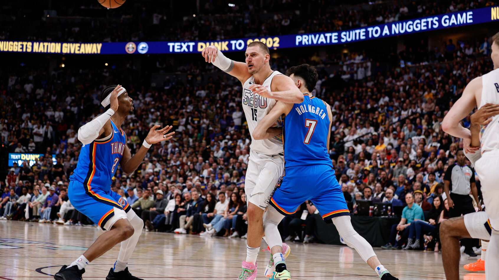 Denver Nuggets center Nikola Jokic passing the ball against the OKC Thunder