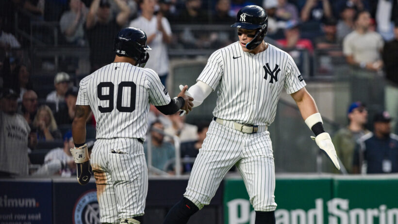Aaron Judge celebrates after a scoring a run versus the Mets.