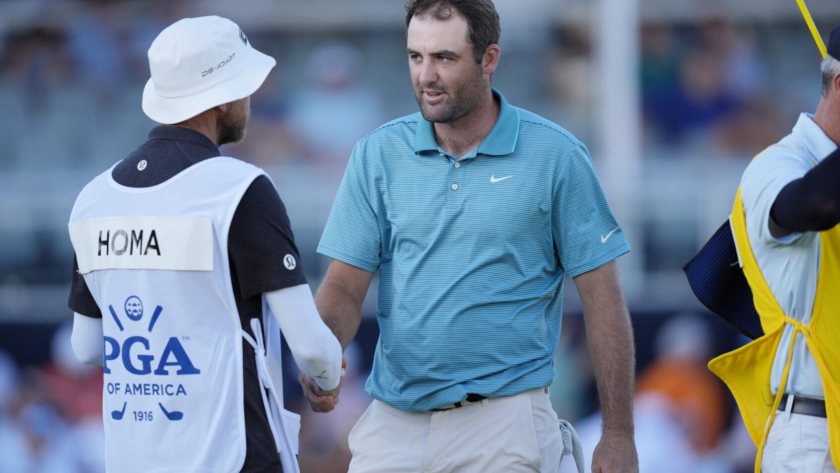 Scottie Scheffler shakes hands after his 3rd round at the PGA Championship.