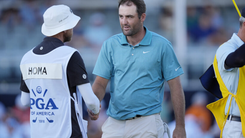 Scottie Scheffler shakes hands after his 3rd round at the PGA Championship.