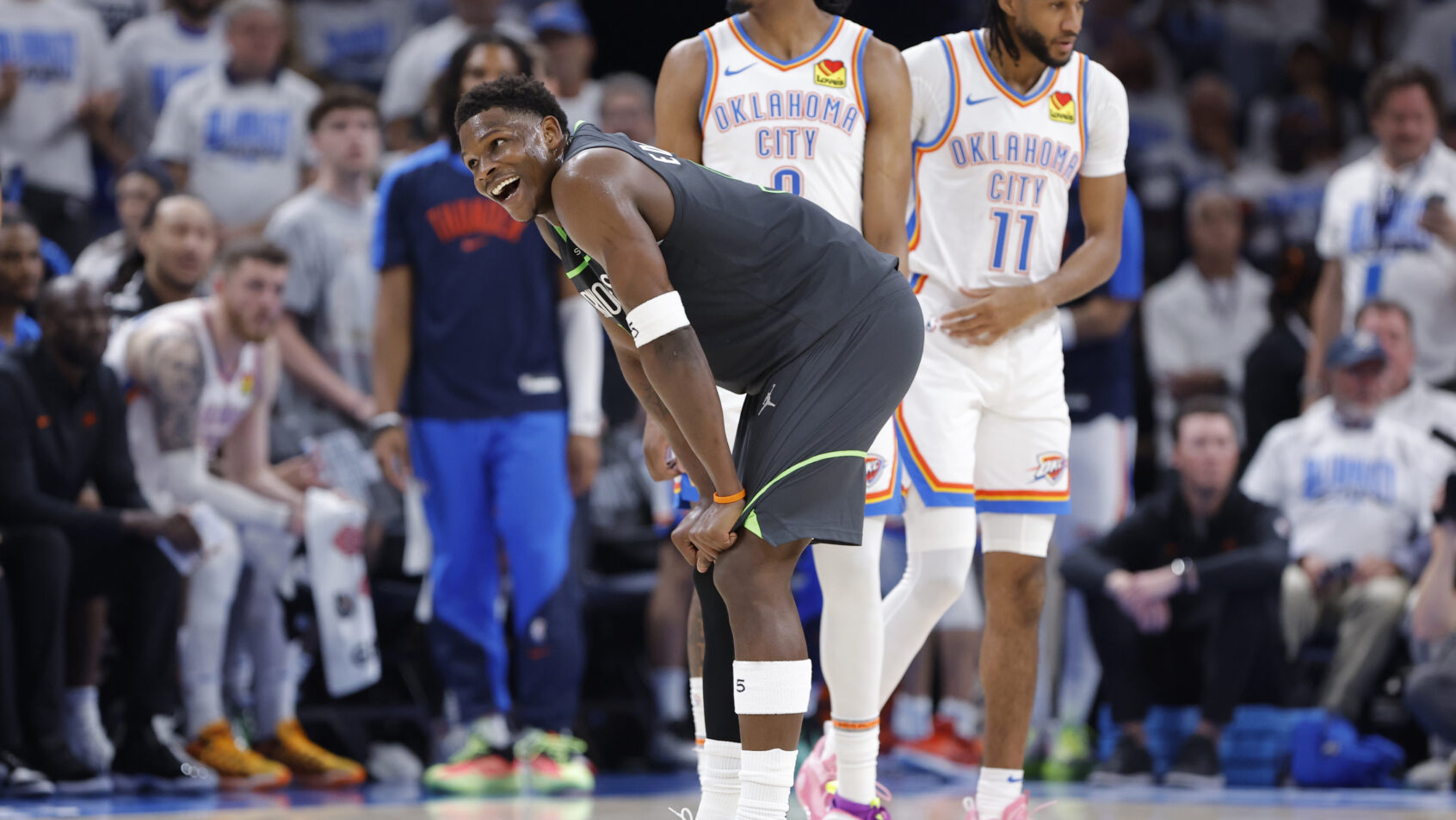 Anthony Edwards hands on knees smiling