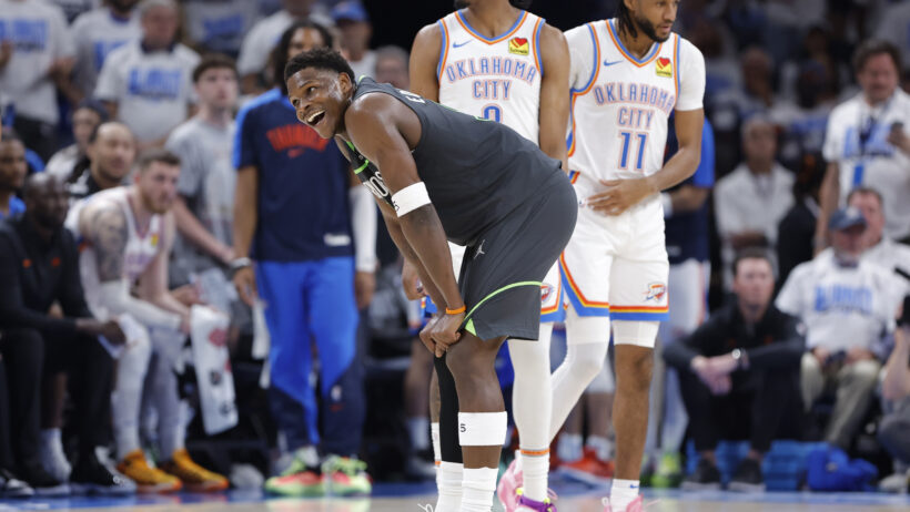 Anthony Edwards hands on knees smiling