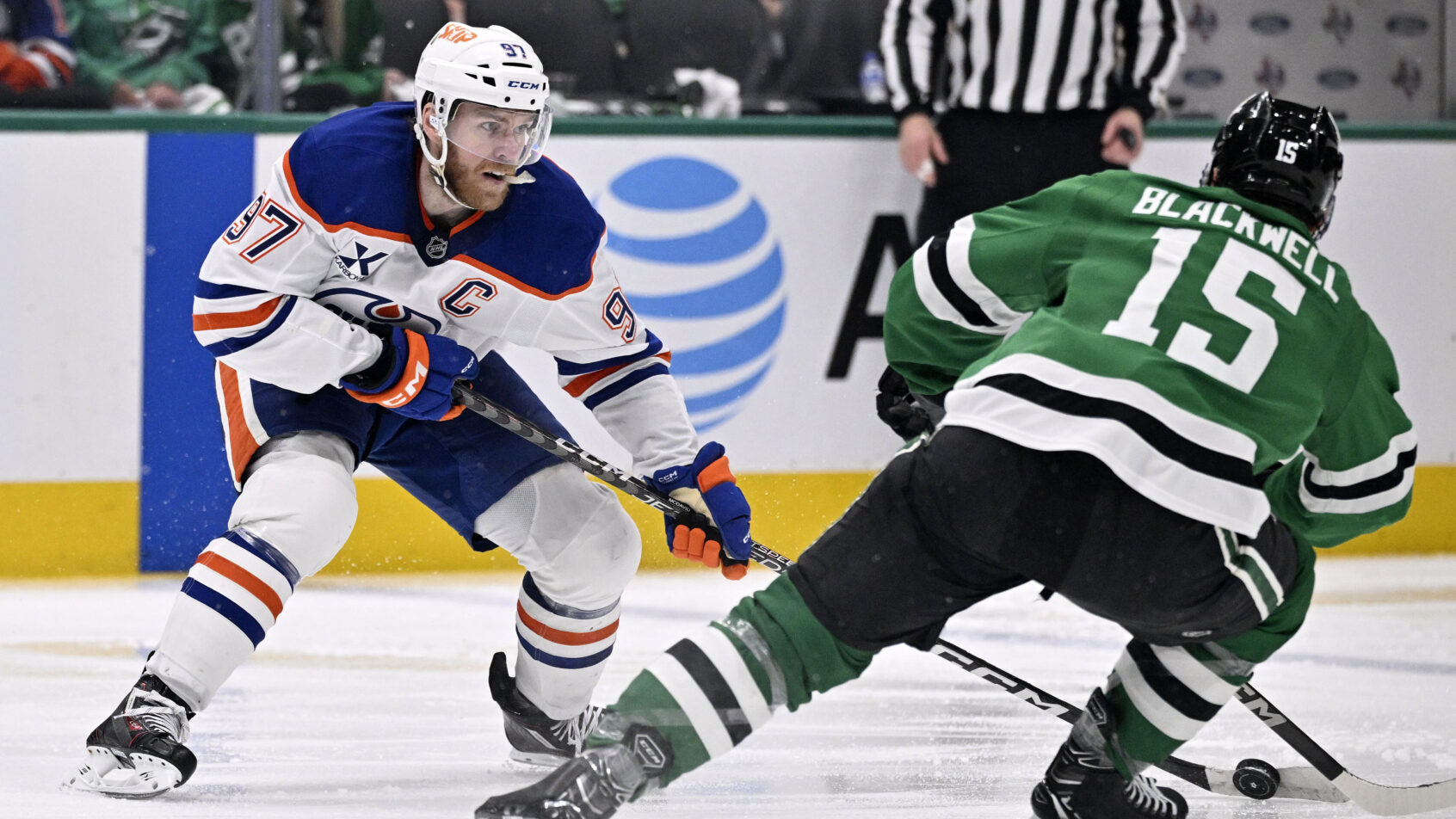 Edmonton Oilers center Connor McDavid skates with the puck past Dallas Stars center Colin Blackwell