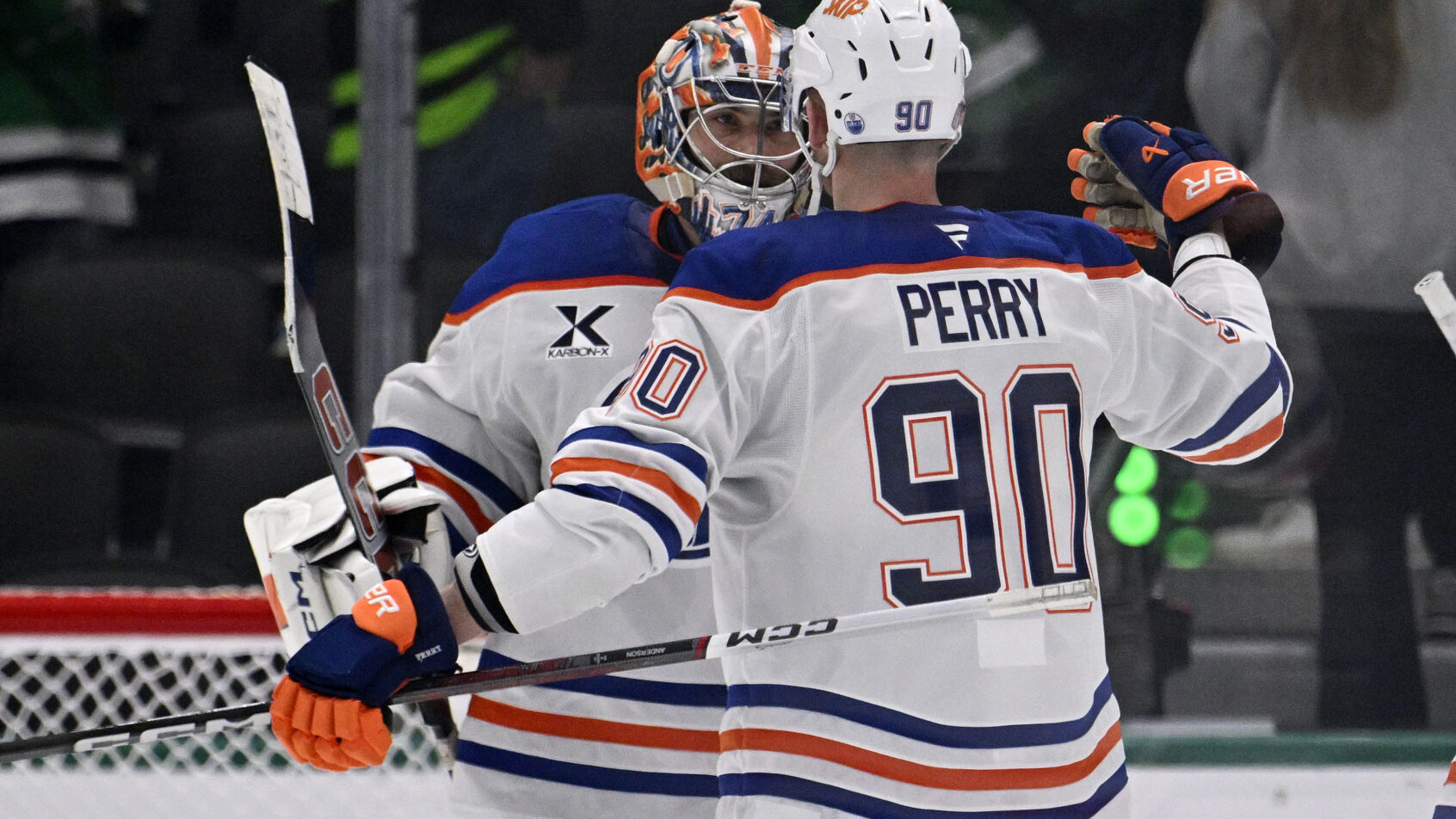 Edmonton Oilers right wing Corey Perry and goaltender Stuart Skinner celebrate
